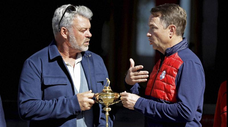 United States captain Davis Love III (R) and Europe captain Darren Clarke with the Ryder Cup in 2016. AP Photo