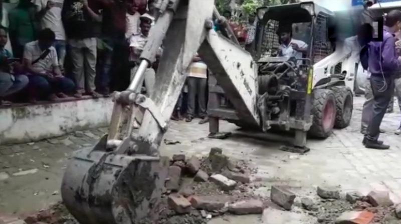 The police are now digging the compound to ascertain if the claims made by the inmate are true. (Photo: Twitter | ANI) The police are now digging the compound to ascertain if the claims made by the inmate are true. (Photo: Twitter | ANI)