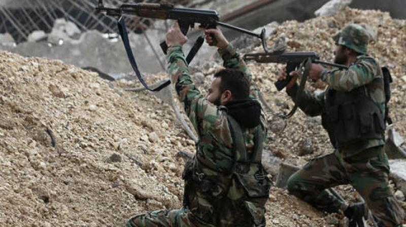 Syrian army soldiers fire their weapons during a battle with rebel fighters at the Ramouseh front line, east of Aleppo. (Photo: AP) Syrian army soldiers fire their weapons during a battle with rebel fighters at the Ramouseh front line, east of Aleppo. (Photo: AP)