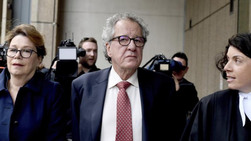 Australian actor Geoffrey Rush (centre) arrives at the Supreme Court in Sydney. (Photo: AP) Australian actor Geoffrey Rush (centre) arrives at the Supreme Court in Sydney. (Photo: AP)