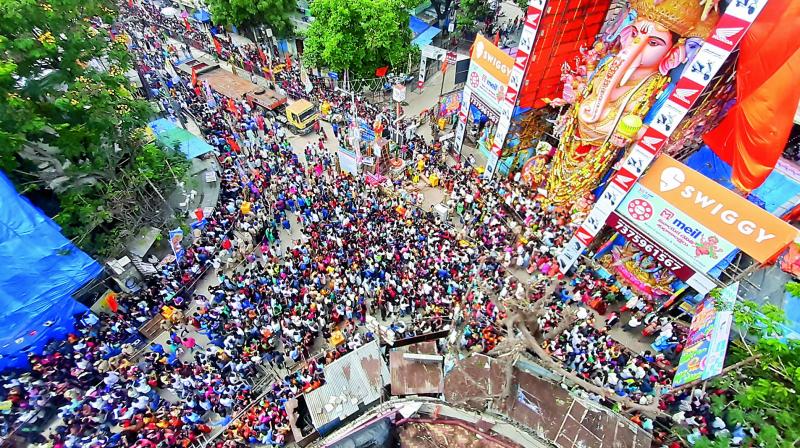 On Tuesday, devotees made their way to Khairtabad to visit the huge Ganesha. Even, Telangana state governor Tamilisai Soundararajan visited the pandal.(Photo: S. Surender Reddy) On Tuesday, devotees made their way to Khairtabad to visit the huge Ganesha. Even, Telangana state governor Tamilisai Soundararajan visited the pandal.(Photo: S. Surender Reddy)
