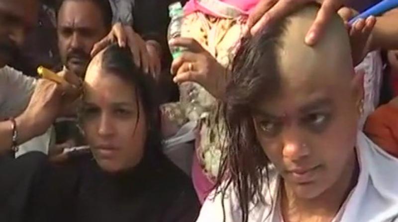 Teachers from across the state had gathered at the Bharat Heavy Electricals Ltd (BHEL) Jamboorie ground where several of them tonsured their heads. (Photo: ANI) Teachers from across the state had gathered at the Bharat Heavy Electricals Ltd (BHEL) Jamboorie ground where several of them tonsured their heads. (Photo: ANI)