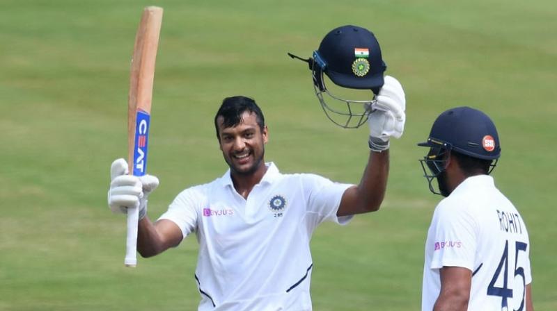 Mayank Agarwal completed his maiden Test hundred while Rohit Sharma made 176 on his opening debut as India headed towards a huge first innings total at lunch on day two of the series opener against South Africa here on Thursday. (Photo:AFP) Mayank Agarwal completed his maiden Test hundred while Rohit Sharma made 176 on his opening debut as India headed towards a huge first innings total at lunch on day two of the series opener against South Africa here on Thursday. (Photo:AFP)