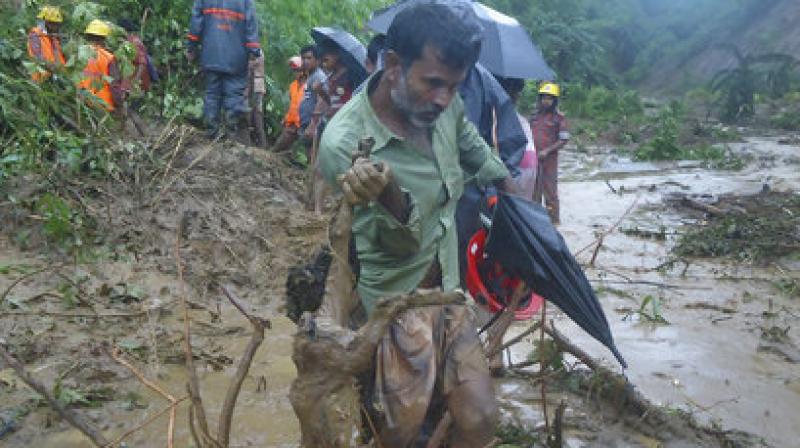 Local people said a landslide pushed 15 army men down to around 30 feet, killing four instantly while a military spokesman in Dhaka said an army major and a captain were among four of their dead personnel. (Photo: AP) Local people said a landslide pushed 15 army men down to around 30 feet, killing four instantly while a military spokesman in Dhaka said an army major and a captain were among four of their dead personnel. (Photo: AP)