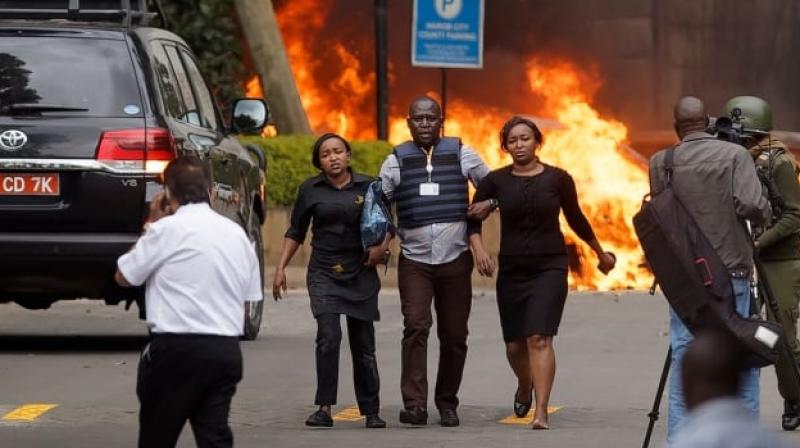 The coordinated assault began with an explosion that targeted three vehicles outside a bank (Photo: AP) The coordinated assault began with an explosion that targeted three vehicles outside a bank (Photo: AP)