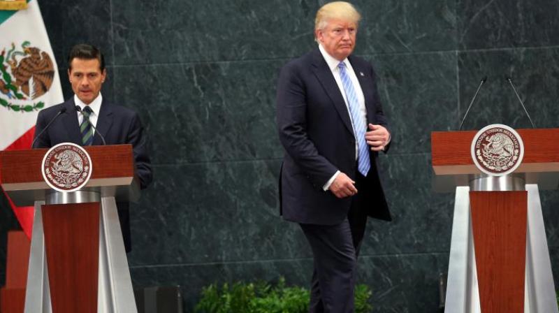 US President Donald Trump and Mexico's President Enrique Pena Nieto during an earlier meeting in Mexico City. (Photo: AP) US President Donald Trump and Mexico's President Enrique Pena Nieto during an earlier meeting in Mexico City. (Photo: AP)