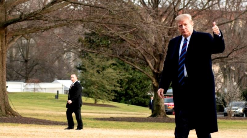 US President Donald Trump gives a thumbs up as he returns to the White House after his annual physical exam on February 8, 2019. (Photo: AFP) US President Donald Trump gives a thumbs up as he returns to the White House after his annual physical exam on February 8, 2019. (Photo: AFP)
