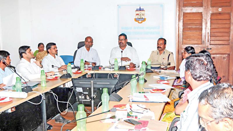 Chennai district electoral officer and corporation commissioner D. Karthikeyan addresses a meeting convened to expedite preparedness for RK Nager bypoll, on Friday. District collector V. Anbuselvan and others attended the meeting. (Photo: DC) Chennai district electoral officer and corporation commissioner D. Karthikeyan addresses a meeting convened to expedite preparedness for RK Nager bypoll, on Friday. District collector V. Anbuselvan and others attended the meeting. (Photo: DC)