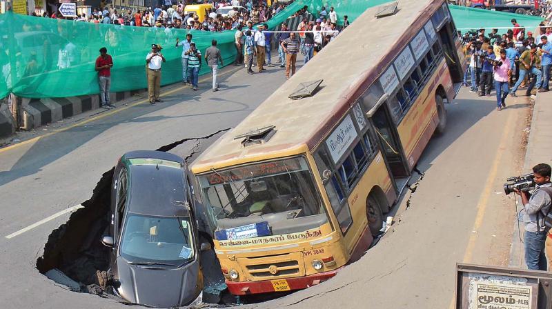 An MTC bus and a car were trapped in a crater which developed on Anna Salai on Sunday afternoon. (Photo: EK Sanjay) An MTC bus and a car were trapped in a crater which developed on Anna Salai on Sunday afternoon. (Photo: EK Sanjay)