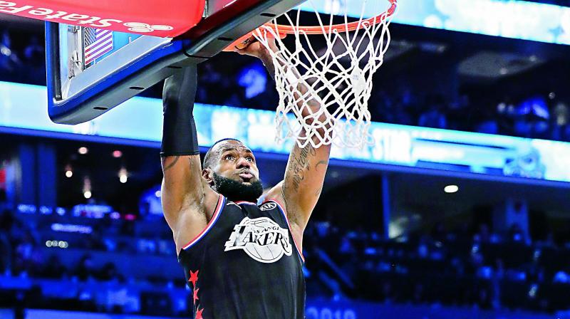 LeBron James dunks against Stephen Curry during the NBA All-Star game in Charlotte on Sunday (Photo: AP) LeBron James dunks against Stephen Curry during the NBA All-Star game in Charlotte on Sunday (Photo: AP)