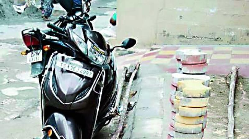 Residents have noticed that the concrete slab placed by the GHMC contractor near BK Bhavan, Karwan, Khairatabad, is blocking their access to the main road which connects them to the Ramsinghpura bus stop, Ring Road and other important places. Residents have noticed that the concrete slab placed by the GHMC contractor near BK Bhavan, Karwan, Khairatabad, is blocking their access to the main road which connects them to the Ramsinghpura bus stop, Ring Road and other important places.
