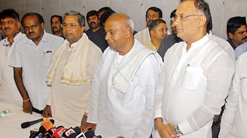 KPCC Working President Eshwar Khandre (extreme right) at a Congress-JD(S) meeting on Tuesday KPCC Working President Eshwar Khandre (extreme right) at a Congress-JD(S) meeting on Tuesday