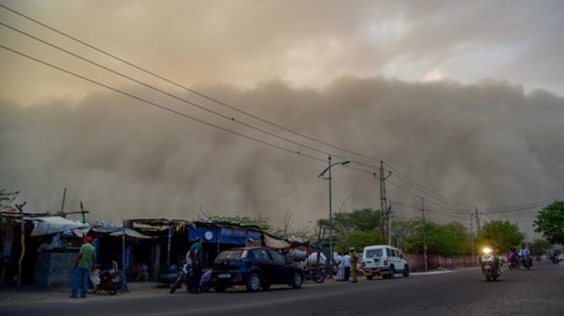 A dust storm is seen building up over the city of Bikaner on Monday. In a fresh advisory by the India Meteorological Department (IMD), dust storm and heavy rain likely at isolated places in Uttar Pradesh, Jammu and Kashmir, Punjab, Himachal Pradesh, western Rajasthan and states in North-east. (Photo:PTI) A dust storm is seen building up over the city of Bikaner on Monday. In a fresh advisory by the India Meteorological Department (IMD), dust storm and heavy rain likely at isolated places in Uttar Pradesh, Jammu and Kashmir, Punjab, Himachal Pradesh, western Rajasthan and states in North-east. (Photo:PTI)
