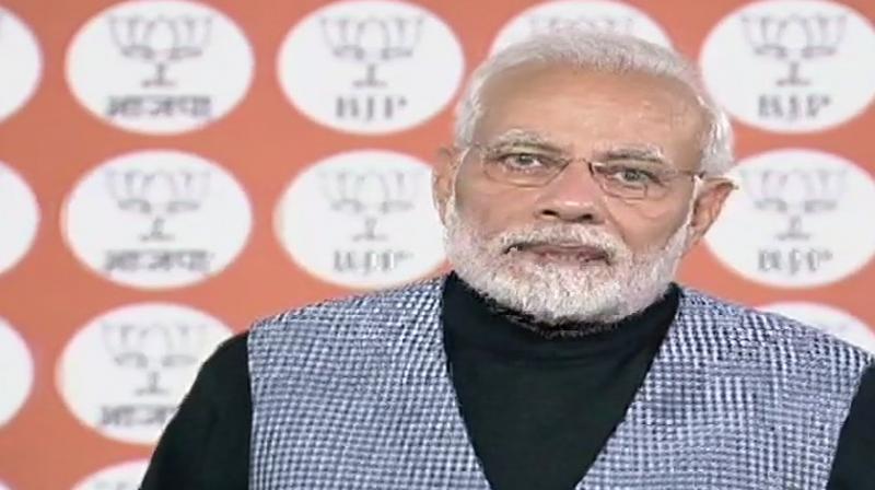 The prime minister was interacting with booth level workers of Vellore, Kanchipuram, Viluppuram and south Chennai districts of Tamil Nadu, and Puducherry, through video conferencing from New Delhi. (Photo: ANI | Twitter) The prime minister was interacting with booth level workers of Vellore, Kanchipuram, Viluppuram and south Chennai districts of Tamil Nadu, and Puducherry, through video conferencing from New Delhi. (Photo: ANI | Twitter)