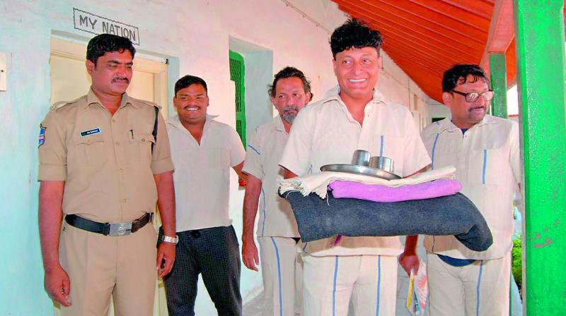 Bobby Chemmanur, chairman of the Bobby Chemmanur International Jewellers Group, carries the items given to him for his stay at the Sangareddy Jail. Bobby Chemmanur, chairman of the Bobby Chemmanur International Jewellers Group, carries the items given to him for his stay at the Sangareddy Jail.