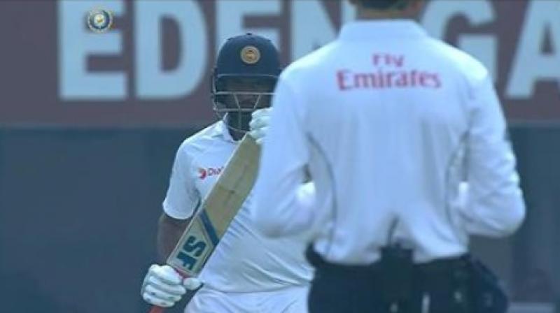 Dilruwan Perera first looked at his partner Rangana Herath and started walking back immediately towards the pavilion. But he suddenly opted to review after turning towards the dressing room during the fourth day's play in India vs Sri Lanka Kolkata Test. (Photo: Screengrab) Dilruwan Perera first looked at his partner Rangana Herath and started walking back immediately towards the pavilion. But he suddenly opted to review after turning towards the dressing room during the fourth day's play in India vs Sri Lanka Kolkata Test. (Photo: Screengrab)