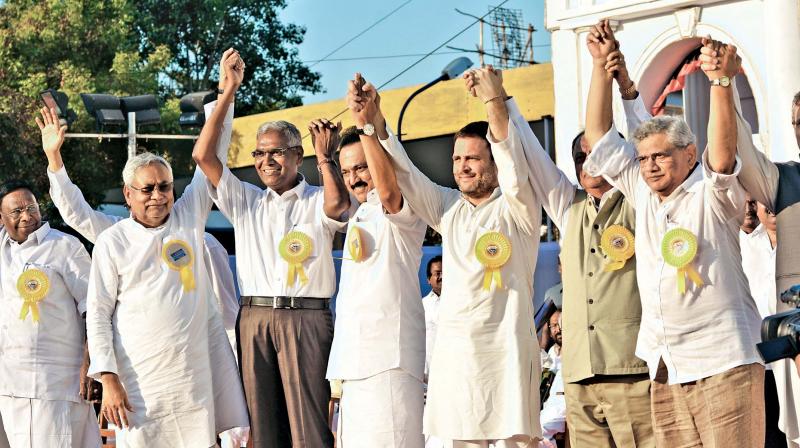 Nine national leaders including Congress vice president Rahul Gandhi and Bihar Chief Minister Nitish Kumar hold hands with DMK’s M.K. Stalin and communist party leaders at the 94th birthday celebrations of Karunanidhi at YMCA grounds on Saturday. (Photo: DC) Nine national leaders including Congress vice president Rahul Gandhi and Bihar Chief Minister Nitish Kumar hold hands with DMK’s M.K. Stalin and communist party leaders at the 94th birthday celebrations of Karunanidhi at YMCA grounds on Saturday. (Photo: DC)