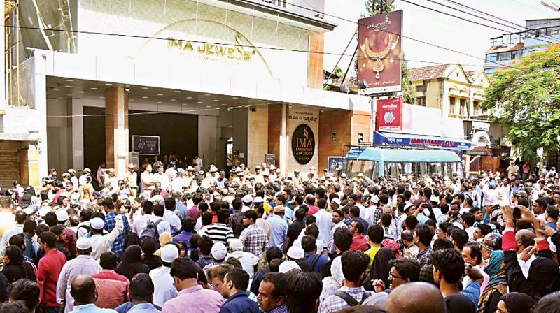 A file photo of investors thronging IMA head office in Shivajinagar after the scam broke out. A file photo of investors thronging IMA head office in Shivajinagar after the scam broke out.