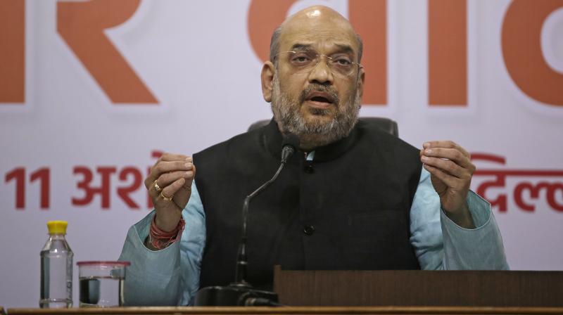 Bharatiya Janata Party (BJP) President Amit Shah addresses the media in New Delhi. (Photo: AP) Bharatiya Janata Party (BJP) President Amit Shah addresses the media in New Delhi. (Photo: AP)