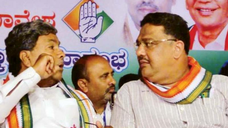 A file photo of Chief Minister Siddaramaiah with Primary and Secondary Education Minister Tanveer Sait. A file photo of Chief Minister Siddaramaiah with Primary and Secondary Education Minister Tanveer Sait.
