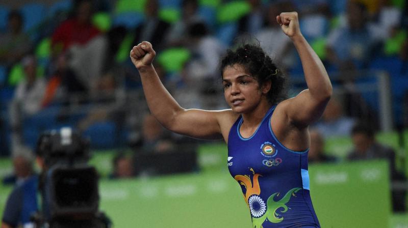 Sakshi lost a point for passivity but took the break with a 2-1 lead after a takedown move. (Photo: PTI) Sakshi lost a point for passivity but took the break with a 2-1 lead after a takedown move. (Photo: PTI)