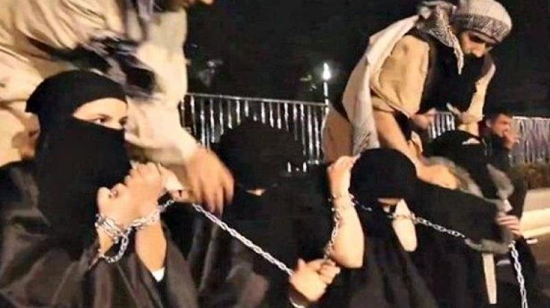 ISIS fighters with captured sex slaves (Photo: YouTube screen grab) ISIS fighters with captured sex slaves (Photo: YouTube screen grab)