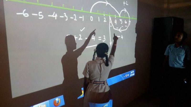 In Chhattisgarh's insurgency-hit Kanker district, children in over 100 government schools are learning basic maths through video lectures in Hindi. (Photo: PTI) In Chhattisgarh's insurgency-hit Kanker district, children in over 100 government schools are learning basic maths through video lectures in Hindi. (Photo: PTI)