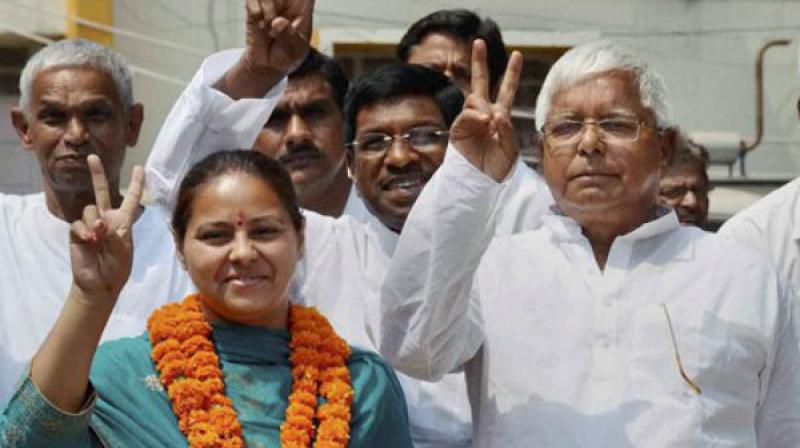 RJD chief Lalu Prasad along with his daughter and party candidate from Patliputra Misa Bharti. (Photo: PTI) RJD chief Lalu Prasad along with his daughter and party candidate from Patliputra Misa Bharti. (Photo: PTI)