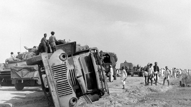 The Indian Army moves past an overturned truck of the Hyderabad Army on September 17, 1948. Picture courtesy Mohammed Safiullah. The Indian Army moves past an overturned truck of the Hyderabad Army on September 17, 1948. Picture courtesy Mohammed Safiullah.