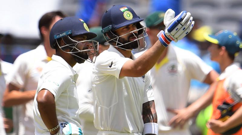 India captain Virat Kohli fell to a controversial catch after becoming the second-fastest batsman to 25 Test centuries on the third day of the second Test against Australia in Perth. (Photo: AFP) India captain Virat Kohli fell to a controversial catch after becoming the second-fastest batsman to 25 Test centuries on the third day of the second Test against Australia in Perth. (Photo: AFP)