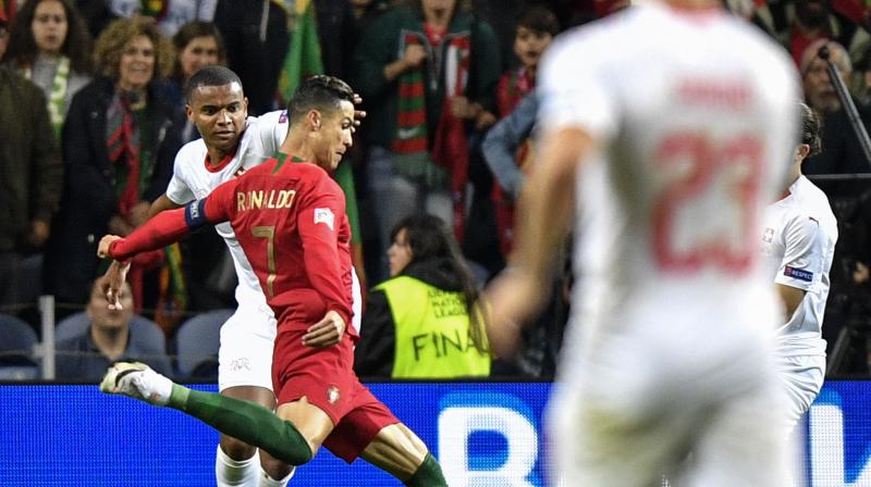 Ronaldo blasted Portugal ahead from a free kick in the 25th minute, his first goal for his country for nearly a year, but the Swiss equalised with a penalty after halftime which will raise more questions over the use of the VAR system. (Photo:AP) Ronaldo blasted Portugal ahead from a free kick in the 25th minute, his first goal for his country for nearly a year, but the Swiss equalised with a penalty after halftime which will raise more questions over the use of the VAR system. (Photo:AP)