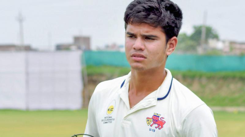 At the auction, Arjun, a budding left-arm pacer and a batsman, who had played unofficial Tests for India-U19, was among the few players in focus. (Photo: PTI) At the auction, Arjun, a budding left-arm pacer and a batsman, who had played unofficial Tests for India-U19, was among the few players in focus. (Photo: PTI)