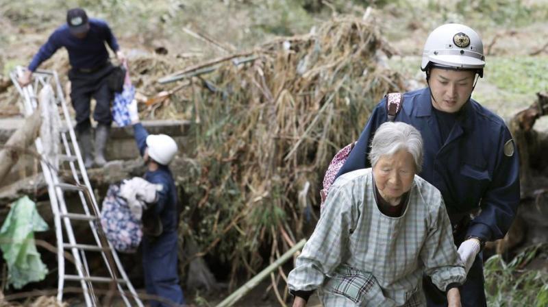 Rescuers in Japan worked into a third day on Tuesday in an increasingly desperate search for survivors of a powerful typhoon that killed nearly 70 people and caused widespread destruction. (Photo: AP) Rescuers in Japan worked into a third day on Tuesday in an increasingly desperate search for survivors of a powerful typhoon that killed nearly 70 people and caused widespread destruction. (Photo: AP)