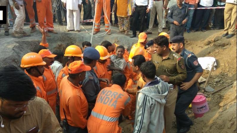 Ravi, son of a labourer working on road constructions, fell into the borewell while playing. (Photo: ANI/ Twitter) Ravi, son of a labourer working on road constructions, fell into the borewell while playing. (Photo: ANI/ Twitter)