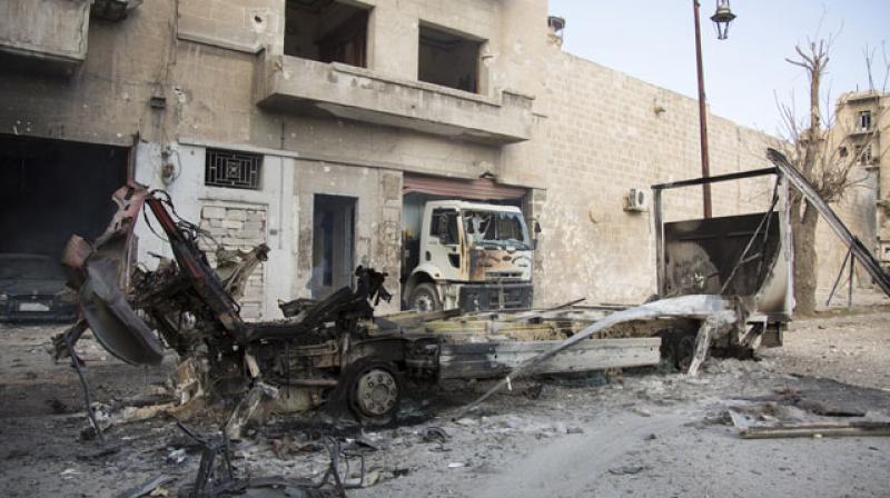 The wreackage of vehicles are seen outside a civil defence centre in Aleppo. (Photo: AFP) The wreackage of vehicles are seen outside a civil defence centre in Aleppo. (Photo: AFP)