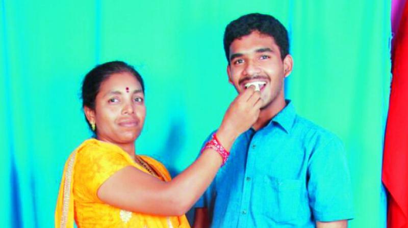 All India second ranker K.V.R. Hemant Kumar’s mother congragulating her son on his success. She said, “My son aims to be a successful computer engineer and he also wants to do research in computer engineering. He used to study 12 to 15 hours a day.” All India second ranker K.V.R. Hemant Kumar’s mother congragulating her son on his success. She said, “My son aims to be a successful computer engineer and he also wants to do research in computer engineering. He used to study 12 to 15 hours a day.”