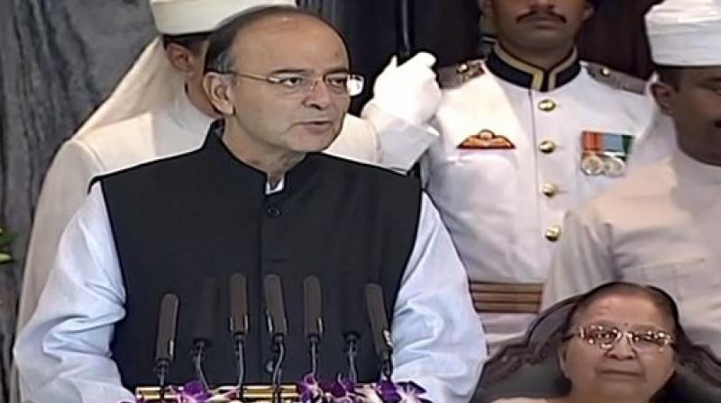 Finance Minister Arun Jaitley addresses the special session of Parliament for the launch of 'Goods and Services Tax (GST)', in New Delhi on Friday. (Photo: PTI) Finance Minister Arun Jaitley addresses the special session of Parliament for the launch of 'Goods and Services Tax (GST)', in New Delhi on Friday. (Photo: PTI)