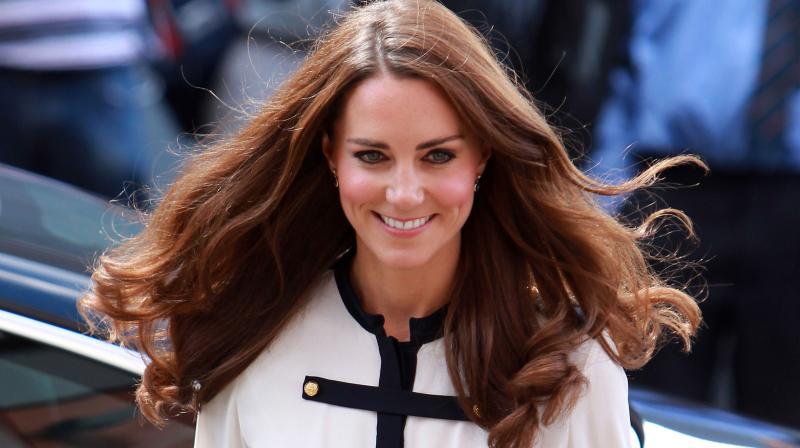 Britain's Catherine, the Duchess of Cambridge, arrives at the Machan Express Coffee bar in the centre of Birmingham on August 19, 2011, which was ransacked during the recent riots in the area. (Photo: AFP) Britain's Catherine, the Duchess of Cambridge, arrives at the Machan Express Coffee bar in the centre of Birmingham on August 19, 2011, which was ransacked during the recent riots in the area. (Photo: AFP)