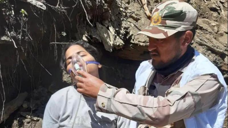 At least 15 pilgrims walking towards Baltal axis were administered oxygen by the border police. (Photo: ANI) At least 15 pilgrims walking towards Baltal axis were administered oxygen by the border police. (Photo: ANI)