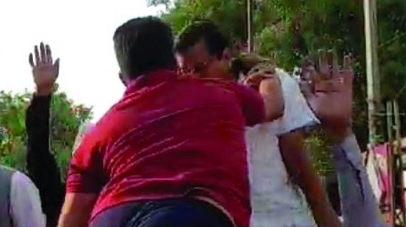 Arvind Kejriwal being slapped by a man during a roadshow in New Delhi, on Saturday. (PTI) Arvind Kejriwal being slapped by a man during a roadshow in New Delhi, on Saturday. (PTI)