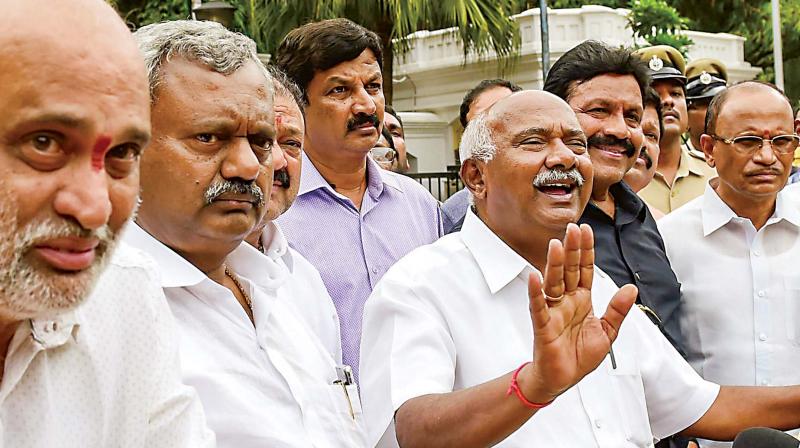 A file photo of disqualified MLAs led by A.H. Vishwanath addressing the media in Bengaluru. A file photo of disqualified MLAs led by A.H. Vishwanath addressing the media in Bengaluru.