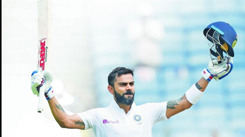 Virat Kohli celebrates after completing his double hundred during the second day of the second Test match against SA in Pune. (Photo: AFP) Virat Kohli celebrates after completing his double hundred during the second day of the second Test match against SA in Pune. (Photo: AFP)
