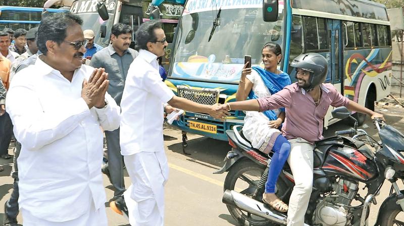 Campaigning for Congress LS candidate Su.Thirunavukarasar in Tiruchy on Saturday, DMK chief M. K. Stalin tries to strike a quick rapport with a couple on motor bike. While the rider stretches out for a handshake with the DMK chief, the woman on the pillion seems thrilled shooting a picture on her mobile. (DC) Campaigning for Congress LS candidate Su.Thirunavukarasar in Tiruchy on Saturday, DMK chief M. K. Stalin tries to strike a quick rapport with a couple on motor bike. While the rider stretches out for a handshake with the DMK chief, the woman on the pillion seems thrilled shooting a picture on her mobile. (DC)