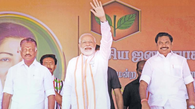 Prime Minister Narendra Modi with Chief Minister Edappadi K Palaniswami, Deputy CM O. Panneerselvam and other leaders at an election campaign rally for the Lok Sabha elections, in Andipatti, on Saturday. (PTI) Prime Minister Narendra Modi with Chief Minister Edappadi K Palaniswami, Deputy CM O. Panneerselvam and other leaders at an election campaign rally for the Lok Sabha elections, in Andipatti, on Saturday. (PTI)