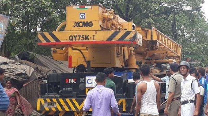 The driver absconded from the scene almost immediately, and soon, an angry mob started vandalising the crane. (Photo: ANI) The driver absconded from the scene almost immediately, and soon, an angry mob started vandalising the crane. (Photo: ANI)