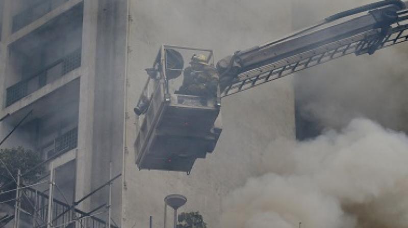 Seven firefighters were trapped by large fallen objects as they tried to search for people inside the factory. (Photo: AP | Representational) Seven firefighters were trapped by large fallen objects as they tried to search for people inside the factory. (Photo: AP | Representational)