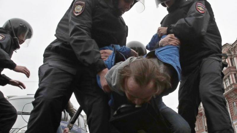 Russian police detain a protester at a demonstration against President Vladimir Putin in St.Petersburg, Russia, Saturday, May 5, 2018. A group that monitors political repression in Russia says more than 350 people have been arrested in a day of nationwide protests against the upcoming inauguration of Vladimir Putin for a new six-year term as president. (Photo: AP) Russian police detain a protester at a demonstration against President Vladimir Putin in St.Petersburg, Russia, Saturday, May 5, 2018. A group that monitors political repression in Russia says more than 350 people have been arrested in a day of nationwide protests against the upcoming inauguration of Vladimir Putin for a new six-year term as president. (Photo: AP)