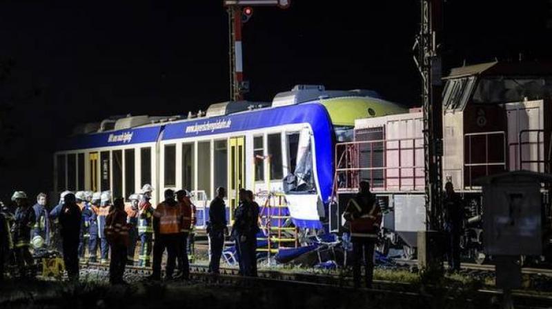 Emergency services attend the scene after a cargo train and a passenger train collided in Aichach, 50km west of Munich, southern Germany, Monday, May 7, 2018. (Photo:AP) Emergency services attend the scene after a cargo train and a passenger train collided in Aichach, 50km west of Munich, southern Germany, Monday, May 7, 2018. (Photo:AP)