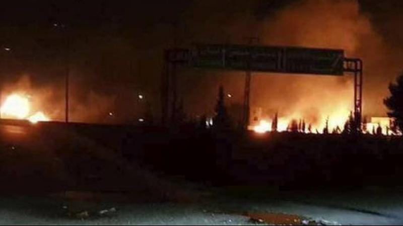 This photo released on May 9, 2018, by the Syrian official news agency SANA, shows flames rising after an attack in Kisweh, south of Damascus, Syria -- an area known to have numerous Syrian army military bases. (Photo: AP) This photo released on May 9, 2018, by the Syrian official news agency SANA, shows flames rising after an attack in Kisweh, south of Damascus, Syria -- an area known to have numerous Syrian army military bases. (Photo: AP)