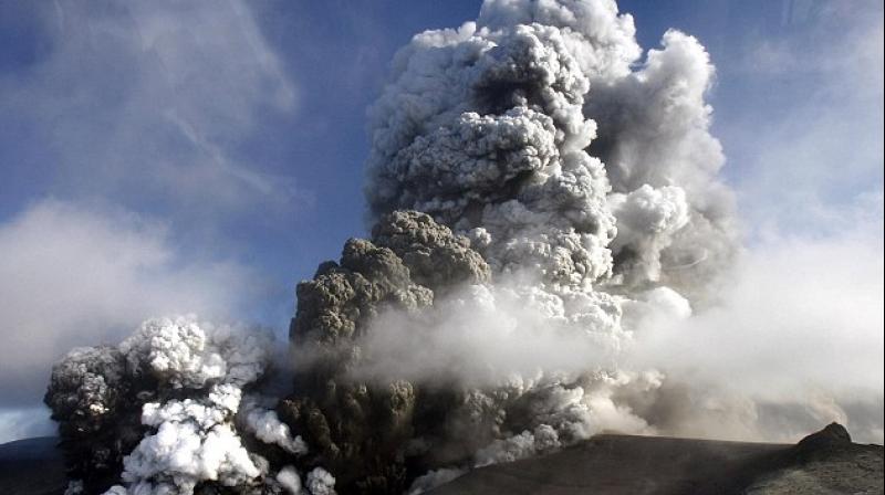 Ash and volcanic smog, or so-called vog, rose up to 12,000 feet (3,657 meters) above Kilauea's crater and floated southwest, covering cars on Highway 11 with gray dust and sparking an "unhealthy air" advisory in the community of Pahala, 18 miles (29 km) from the summit. (Photo: AP) Ash and volcanic smog, or so-called vog, rose up to 12,000 feet (3,657 meters) above Kilauea's crater and floated southwest, covering cars on Highway 11 with gray dust and sparking an "unhealthy air" advisory in the community of Pahala, 18 miles (29 km) from the summit. (Photo: AP)